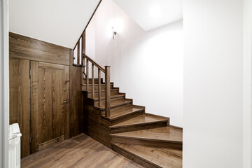Stairs made of natural oak wood in the house