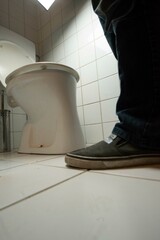 urination on a toilet in a restroom