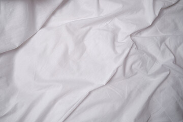 Obraz premium Top view of sheets and pillows. White linens. Bed texture