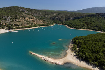 Obraz premium Aerial view on blue lake Sainte-Croix-du-Verdon and villages on cliffs, tourists destination in France