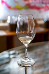 Wine tasting in underground cellars caves of French wine domain in Puligny-Motrachet village, Burgundy, France