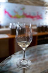 Wine tasting in underground cellars caves of French wine domain in Puligny-Motrachet village, Burgundy, France