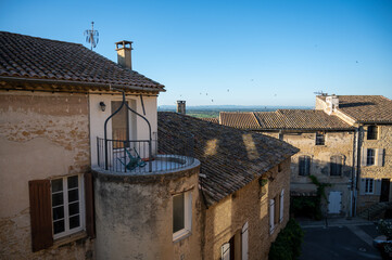 VIew on medieval buildings in sunny day, vacation destination wine making village Chateauneuf-du-pape in Provence, France