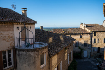 VIew on medieval buildings in sunny day, vacation destination wine making village Chateauneuf-du-pape in Provence, France