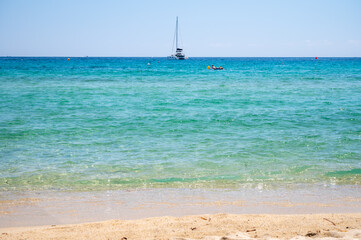 Fototapeta na wymiar Crystal clear blue water of legendary Pampelonne beach near Saint-Tropez, summer vacation on white sandy beaches of French Riviera, France