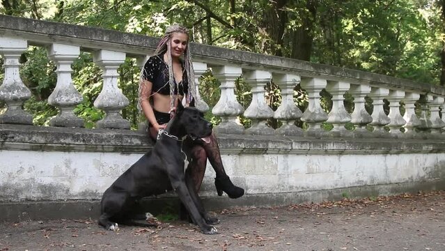 Woman with great dane dog on the photoshoot