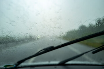 Driver point of view inside a car while driving on a rainy day under a storm in bad visibility POV Car 