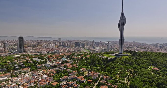Istanbul Turkey Aerial v73 fly towards camlica tower at k&uuml;&ccedil;&uuml;k &ccedil;amlıca capturing downtown cityscape and bosphorus strait meets sea of marmara in the background - Shot with Mavic 3 Cine - July 2022