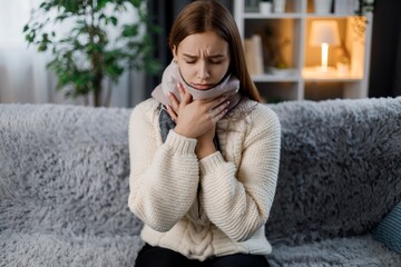 Woman in scarf having fever