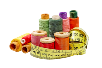 Multicolored thread spools and measurement tape isolated on transparent.