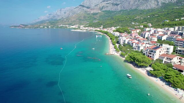 Aerial drone video of tropical paradise turquoise bay and sandy beach in popular Mediterranean destination island