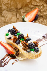 eclair with berry and chocolate cream