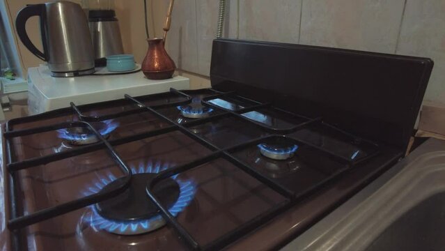 blue natural gas burns gas stove on all burners ecology energy crisis concept. High quality 4k footage
