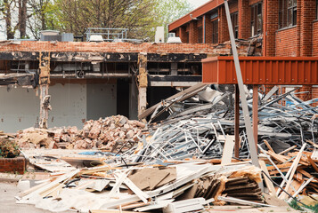 Ruins of a demolished building. Dismantling an old building. Pile of rubble at demolishing site