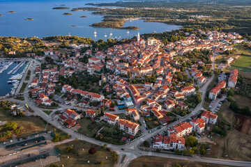 Aerial view to the town of Vrsar (Orsera) on Istrian coast of Croatia at sunrise. - 544890925