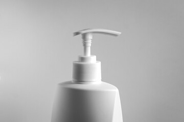 Fototapeta na wymiar Plastic bottle of liquid soap with dispenser pump