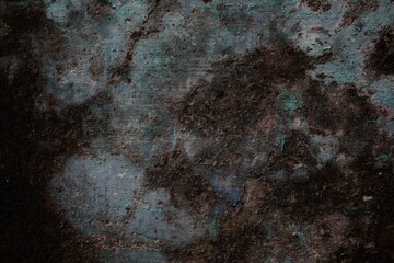 background concept using old cracked wall material, peeling wall surface forming abstract art, old wall background full of cracks and moss