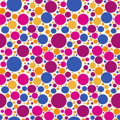 Seamless pattern multi-colored balls of different sizes, blue, pink, burgundy, orange, yellow. Fabric with colorful polka dots, color bubbles