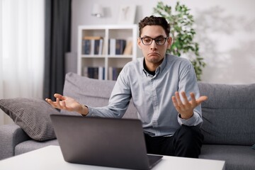 Man with laptop having conference