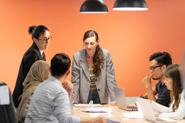 international male and female business meeting group. caucasian leader explain company plan for worker to work with good leadership. female boss talking in meeting and respectful for every employee