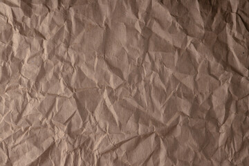 crumpled paper.sheet of brown cardboard paper. detailed high resolution texture. abstract background for wallpaper.