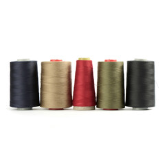 Colored thread in spools on a white background