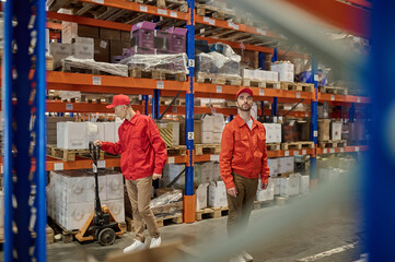 Fototapeta premium Two men working in the storage area