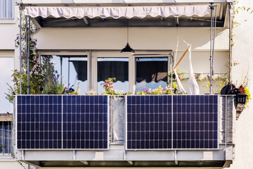 Solar Panel on Balcony of Modern Apartment Building. Modern Balcony with Solar Panels, Marquise and Garden - obrazy, fototapety, plakaty
