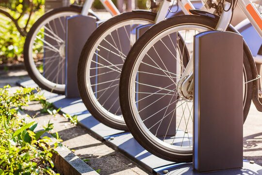 Electric Bikes charging batteries in City Charging Station. To rent. Rental ebike or e-bike