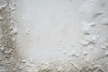 Problem of moisture damage acrylic white painting crack surface texture on exterior dirty stain concrete structure wall background by humidity.home repair old construction concept,renovation house.