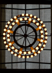 two rows of lights in a circle one bulb out 