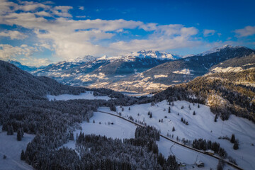 A Mountain valley near Techendorf and lake Weissensee in Carinthia or Karnten, Austria. Panoramic aerial drone picture. January 2022