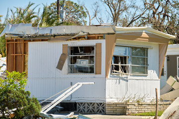 Destroyed by hurricane Ian suburban house in Florida mobile home residential area. Consequences of...