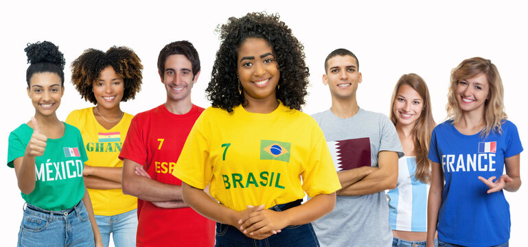 Pretty soccer fan from Brazil with supporters from Spain Ghana Mexico Qatar Argentina and France