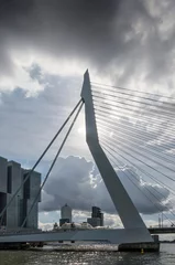 Foto op Aluminium Rotterdam, The Netherlands, September 29, 2022: dramatic clouds over Erasmus bridge, Wilhelmina Pier and the river Nieuwe Maas © Frans