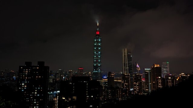Illuminated Buildings In City At Night