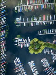 Boats in a marina, aerial view, countryside.  