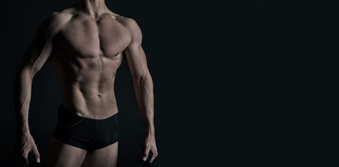 Fototapeta na wymiar muscular bodybuilder isolated on black background. muscular bodybuilder on banner with copy space.