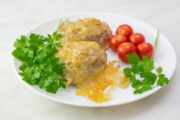 Minced chicken cutlet, turkey meat. Meatballs baked in the oven under cheese. Healthy dinner for the whole family