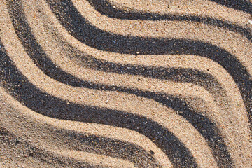 Fototapeta na wymiar Wavy pattern of natural beach sand background for summer designs