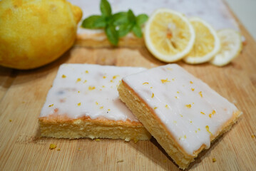 Ready lemon cake with icing on top and decoration
