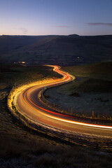 Light Trails -  Car lights going down a winding road