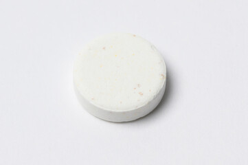 Fototapeta na wymiar Close-up white medicine pills on white background