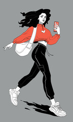 Young beautiful brunette girl is walking with a phone in her hand