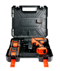 a set of cordless drills with two batteries in red and black in a black open case on a white background