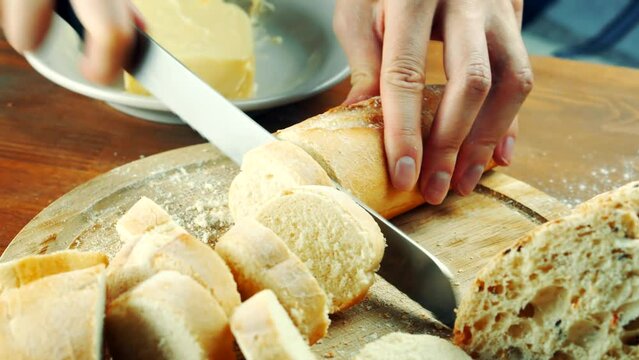 cutting white wheat baguette for antipasto bruschetta