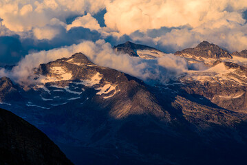 Dramatic clouds above the Glockner Group of the Hohe Tauern range in Austrian alps.