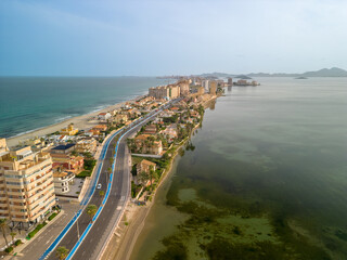 Obraz premium La Manga del Mar Menor Murcia spain, aerial Spectacular aerial images with drone view of the lagoon and the Mediterranean Sea at sunset