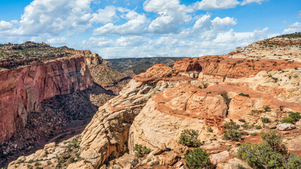 On the Cassidy Arch Trail with a view of the arch and the Grand Wash, at the Capitol Reef National Park 