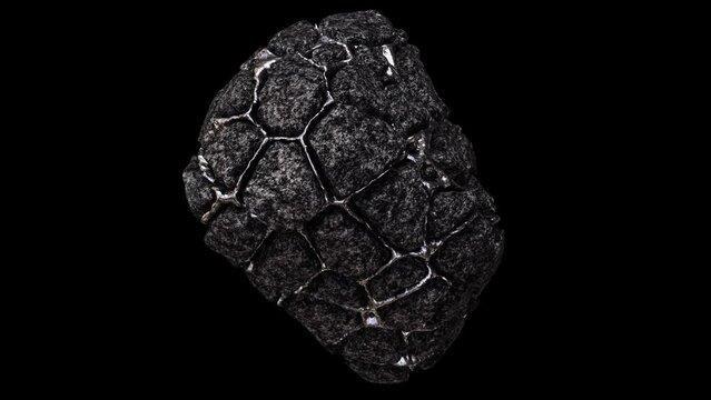 Realistic looping 3D animation of the spinning weathered aged dark granite or piece of ore with shining silver metal inclusions rendered in UHD with alpha matte